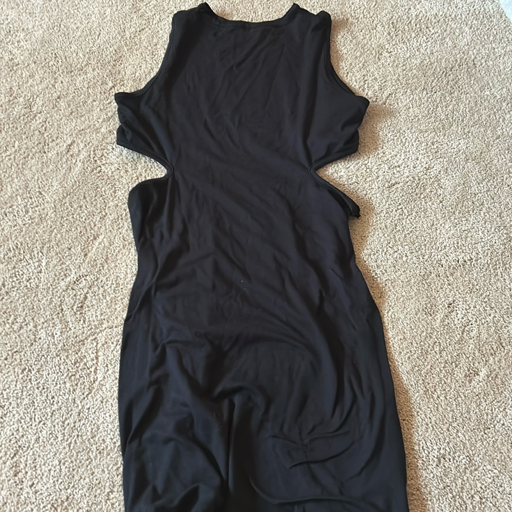 A black long dress with holes on the side